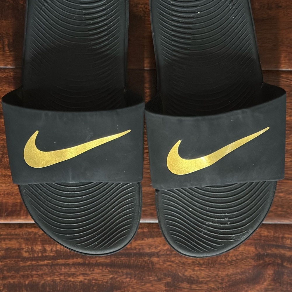 Nike Black and Gold Slides